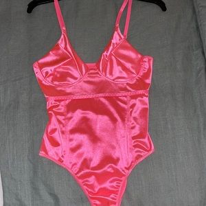 Hot pink body suit